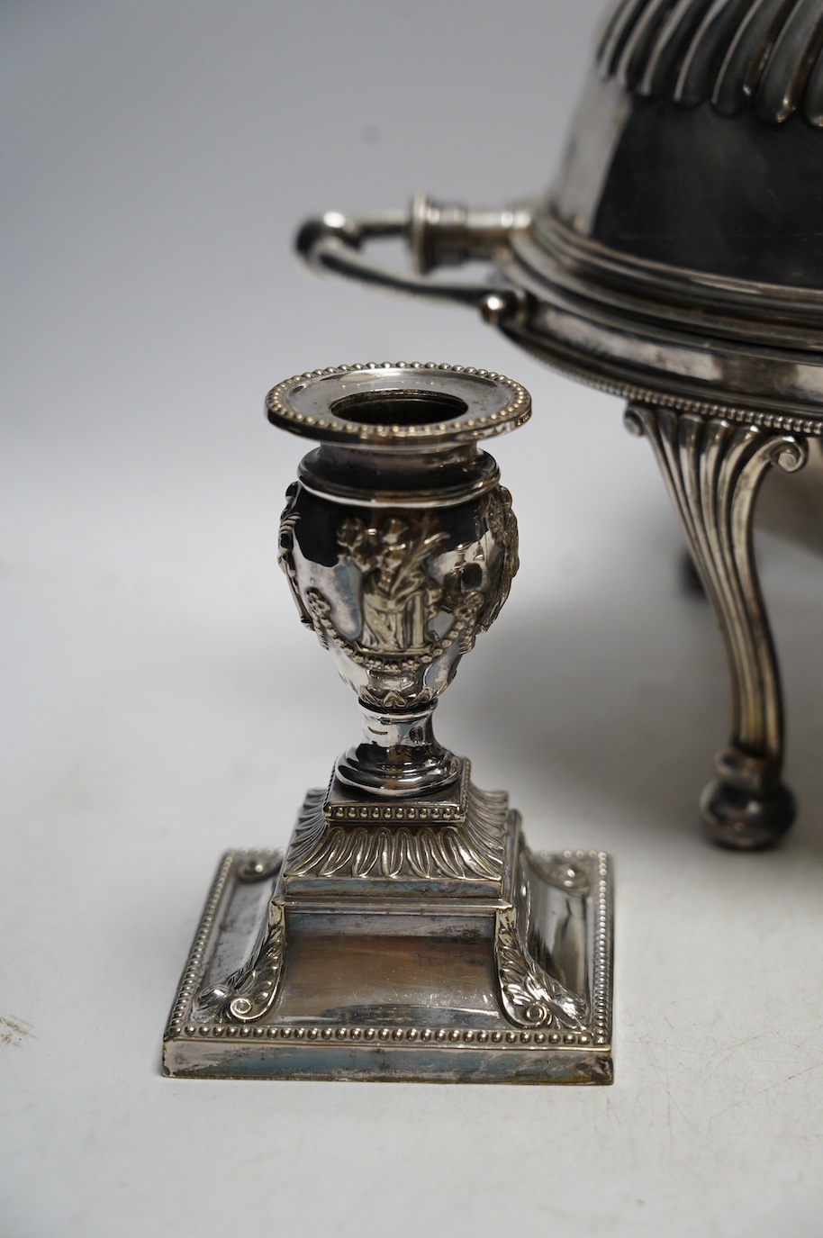 An Edwardian plated breakfast dish and sundry plated wares to include four pairs of candlesticks / chamber sticks. Condition - fair to good